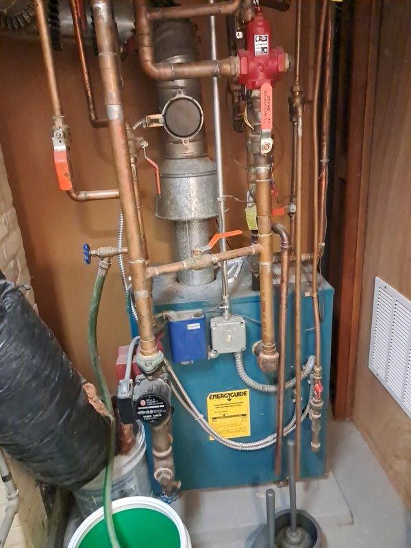 Performed boiler tune-up service on 20-year-old system after customer reported no heat to second floor radiators. Diagnosed airlock in system preventing proper circulation and critically low water pressure. Purged air from the system, restored water pressure to 18psi, verified proper radiator heating throughout the house, and confirmed normal system operation after checking burners, heat exchanger, flue, fresh air intake, pumps, relay controls, gas pressure, and combustion air.