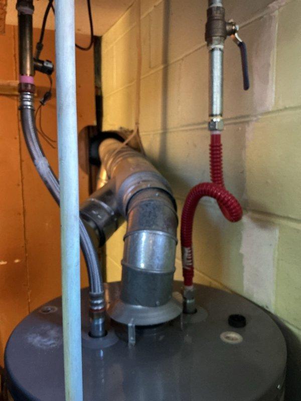 Installed water line connection for a humidifier system utilizing a tee fitting. Successfully completed the repipe work above the heating unit, ensuring proper water supply to the humidifier. All connections were secured and tested for proper function.