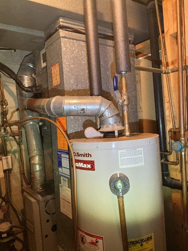 Responded to low water pressure issue in kitchen. Upon inspection, identified outdated water heater, broken main service valves, and outdated pressure reducing valve (PRV) as contributing factors. Assessed upstairs bathroom components including toilet, shower valve, faucet, angle stops and supply lines, all requiring replacement. Provided multiple estimates for necessary repairs and ADA compliant toilet installation.