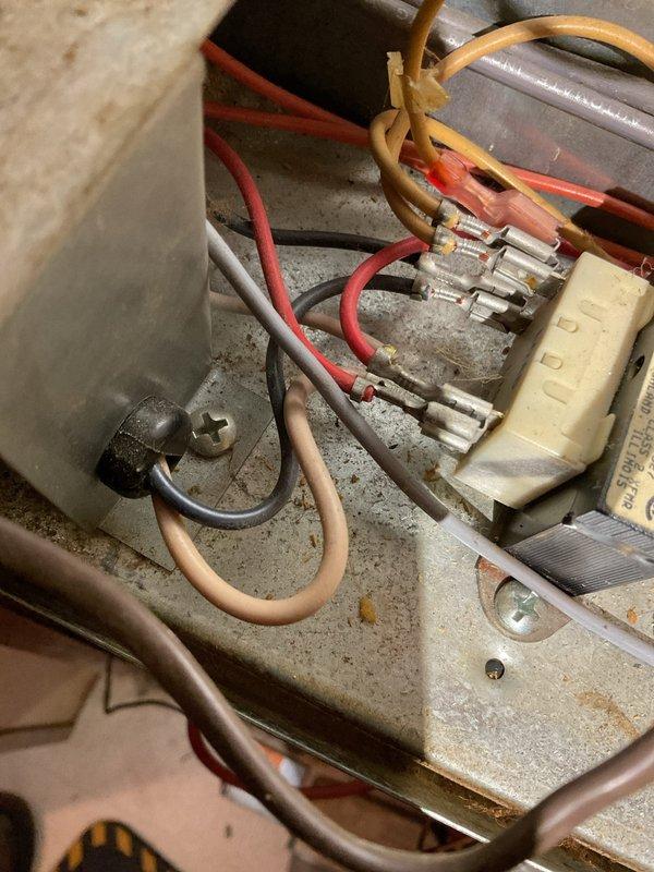 Responded to service call for 20-year-old furnace not running despite pilot light being on. Diagnostic testing revealed transformer receiving 120V but not outputting required 24V to engage gas valve. Identified possible left limit switch failure. Recommended transformer replacement and possible limit switch repair/replacement to restore heating functionality.
