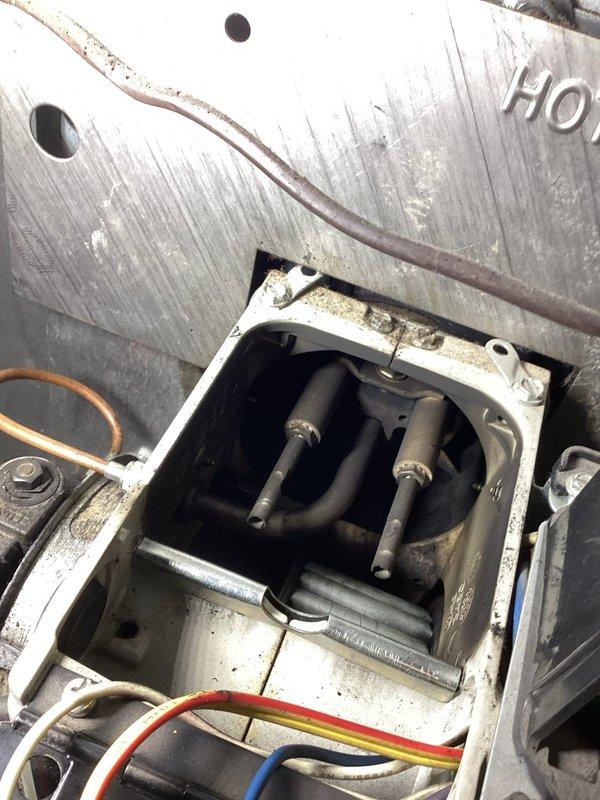 Responded to no heat complaint involving an oil furnace in lockout condition. Diagnosed electrical issue in the Beckett assembly control module, specifically identifying a damaged wire in the ignition system. Repaired faulty wiring, tested system operation, and verified normal heating function was restored.