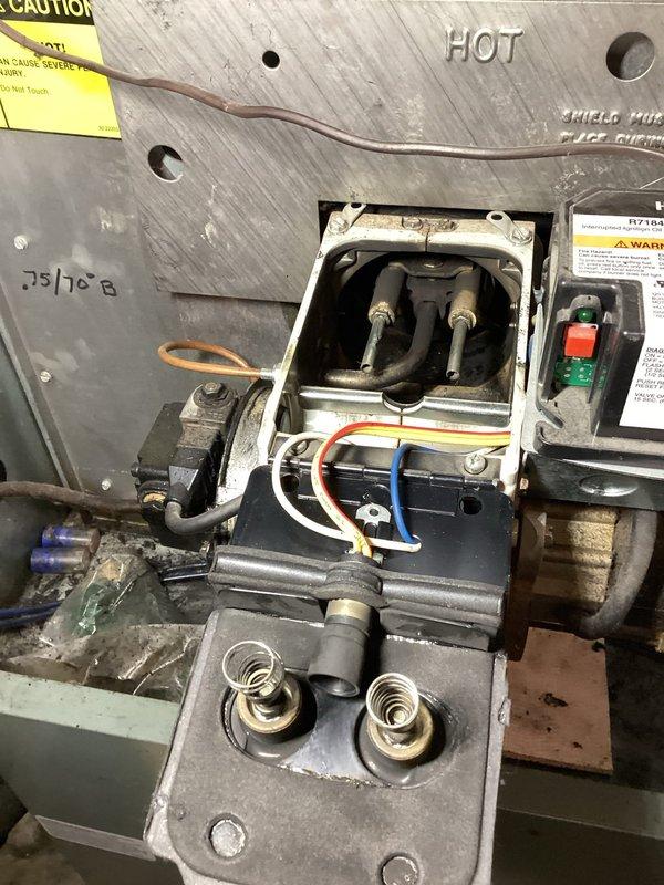 Responded to no heat complaint involving an oil furnace in lockout condition. Diagnosed electrical issue in the Beckett assembly control module, specifically identifying a damaged wire in the ignition system. Repaired faulty wiring, tested system operation, and verified normal heating function was restored.