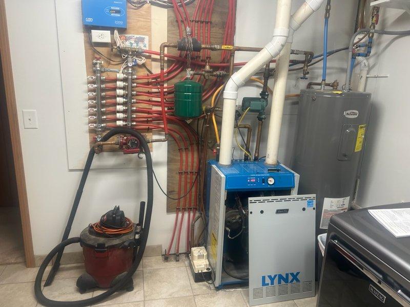 Responded to no heat call for LYNX boiler showing lockout condition that customer had reset twice unsuccessfully. Upon testing, observed boiler firing but quickly overheating, indicating potential issues with either the return pump operating intermittently or the boiler control board failing to properly energize the pump. After system cooldown and retest, all components functioned normally with proper temperature maintenance, suggesting an intermittent fault. Unable to reproduce failure mode for definitive diagnosis; recommended monitoring with potential replacement of pump and/or control board as next troubleshooting steps.