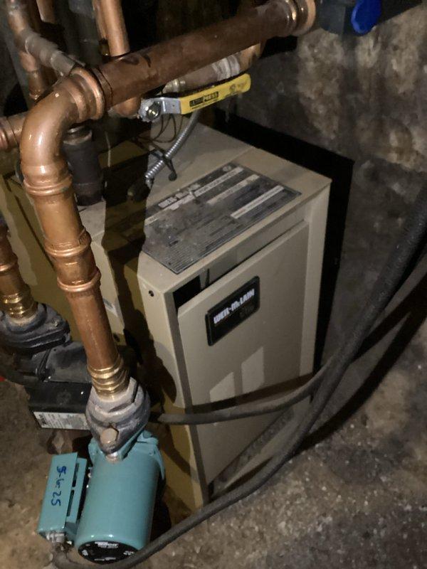 Responded to no heat complaint for bathroom radiator. Diagnosed low water pressure in Weil-McLain boiler system. Added water to restore system to proper operating pressure (20 psi) and bled air from the affected radiator until heat was restored.