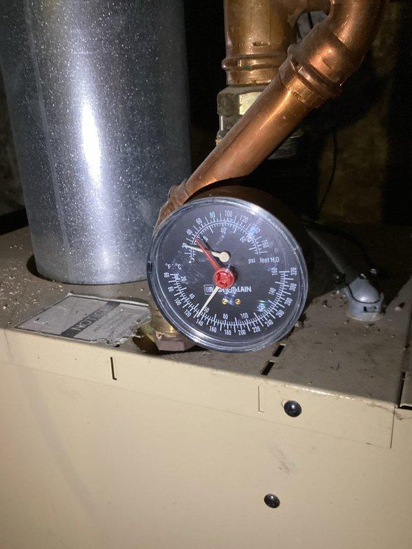Responded to no heat complaint for bathroom radiator. Diagnosed low water pressure in Weil-McLain boiler system. Added water to restore system to proper operating pressure (20 psi) and bled air from the affected radiator until heat was restored.