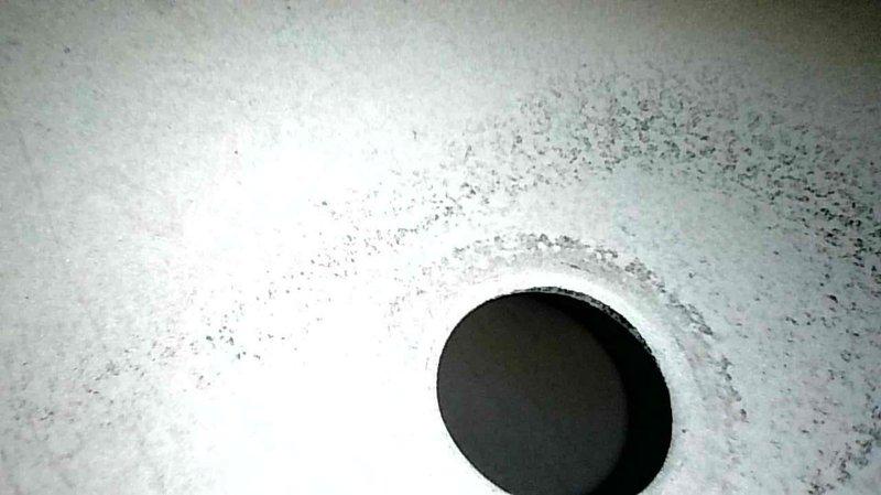 Responded to no-heat call for aging system where temperature was set to 70°F but only reaching 66°F. Diagnostic inspection revealed clogged condensate drain line backing up into the inducer motor. Service performed included clearing obstructed drain line, which restored proper system operation and heat production.