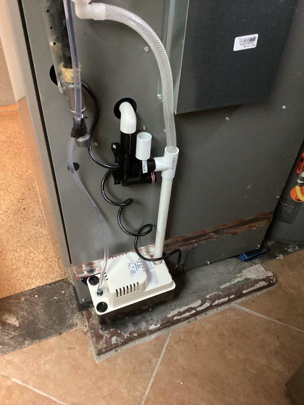 Diagnosed intermittent GFCI tripping causing condensate pump failure and water leakage. Replaced faulty condensate pump and corrected improper low voltage wiring between thermostat, furnace board, and humidifier controls that was causing operational issues. Replaced humidifier controller, verified proper system operation through testing cycle.