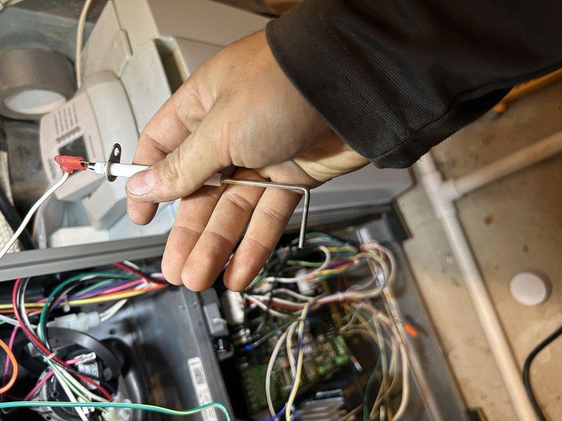 Performed annual maintenance on 1-year-old furnace including operational testing, temperature rise and gas pressure verification with minor low-fire pressure adjustment, drain cleaning, and component inspection. System functioning properly with recently changed air filter and serviceable humidifier pad.