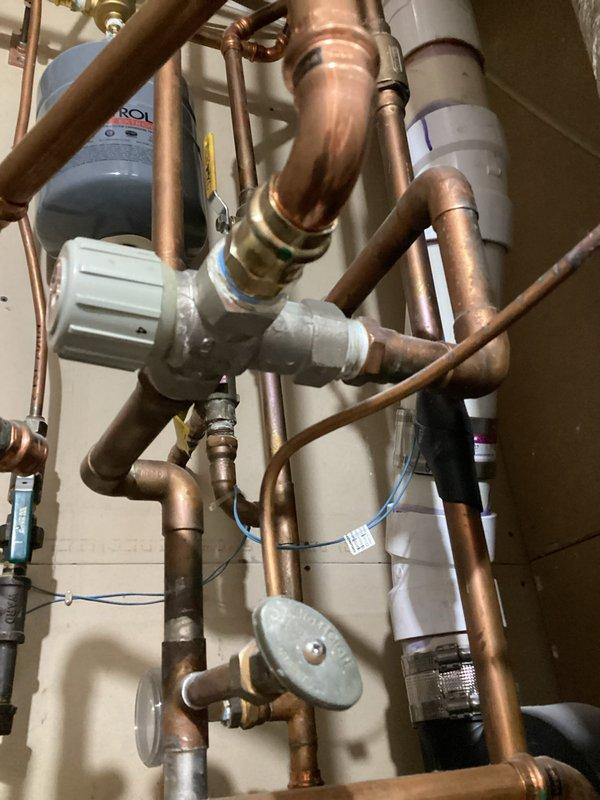 Performed comprehensive boiler tune-up on Bradford White water heater Combi unit. Inspected heating system components including pilot light, pumps, manifolds, and zone valves. Cycled system to verify proper operation of all zones and confirmed thermostat functionality.