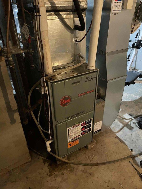 Responded to no heat issue on a 24-year-old Rheem Classic Series furnace. Diagnosed water in pressure switch hose preventing proper operation, which interrupted power to the gas valve. Cleared condensate lines by blowing out and flushing with hot water, though trap could not be removed. Verified proper system operation through multiple test cycles and confirmed normal function after running for 10 minutes.