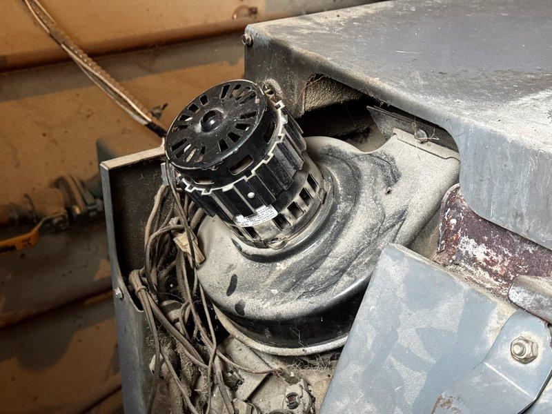 Diagnosed noise concerns in customer's HVAC systems. Found heat pump noise was normal operation during defrost cycle, but identified locked inducer motor on natural gas furnace requiring replacement. Also inspected barn woodstove with locked fan motor; noted parts may be difficult to source as manufacturer is no longer in business. Prepared estimates and parts orders for both repair issues.