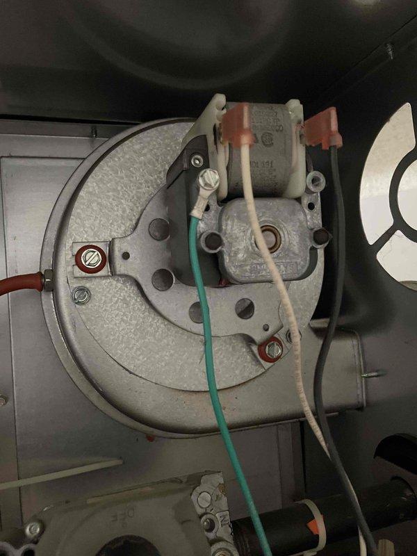 Responded to no-heat call for Reznor wall-mounted heater in garage. Diagnosed failed inducer motor exhibiting internal arcing when attempting operation despite receiving power. Temporarily disabled unit for safety to prevent potential fire hazard, and communicated findings to customer via phone.