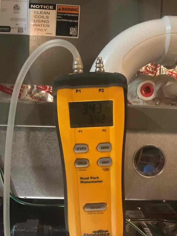 Performed annual maintenance on 1-year-old furnace system. Conducted electrical testing with multimeter to verify proper voltage and connections. Measured gas pressure using dual port manometer, confirming readings within manufacturer specifications (11.7/2.4). All components functioning normally, no issues identified.