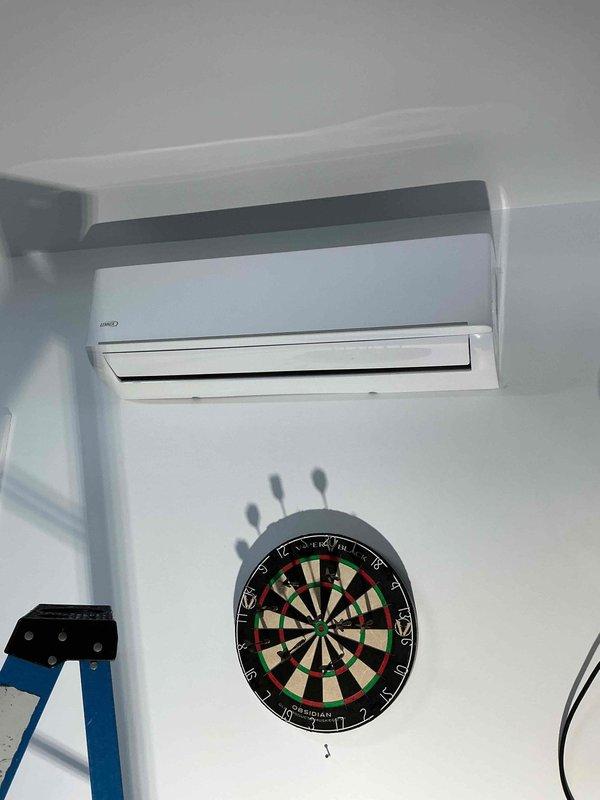 Performed diagnostic assessment on non-functional 1.5-year-old Lennox mini-split system and determined the system is completely depleted of refrigerant charge, explaining the no heat/cool complaint. Visual inspection of both indoor wall-mounted unit and outdoor condenser revealed no obvious external damage, but system requires leak detection and subsequent refrigerant system repairs to restore operation. Discussed findings with homeowners and recommended follow-up with service advisor to review repair options.