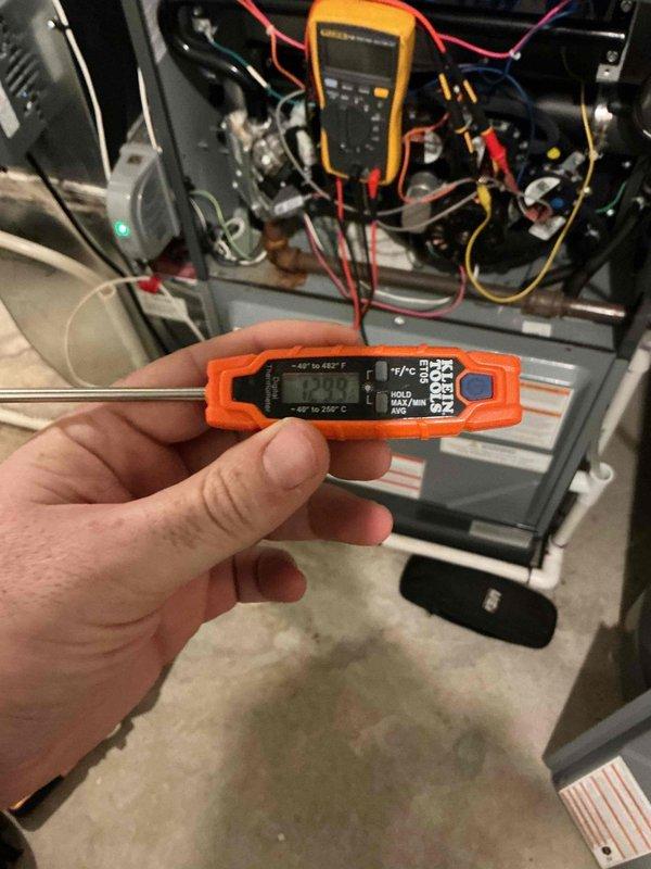 Performed comprehensive furnace inspection and tune-up on 7-year-old system. Diagnostic testing revealed expired UV bulb, though still functioning. All critical components (igniter, flame sensor, draft motor, blower motor) were operating properly with clean blower wheel. Combustion analysis confirmed safe and efficient operation despite minor heat exchanger rusting. Temperature and electrical readings were taken with digital thermometer and clamp meter to verify system parameters.