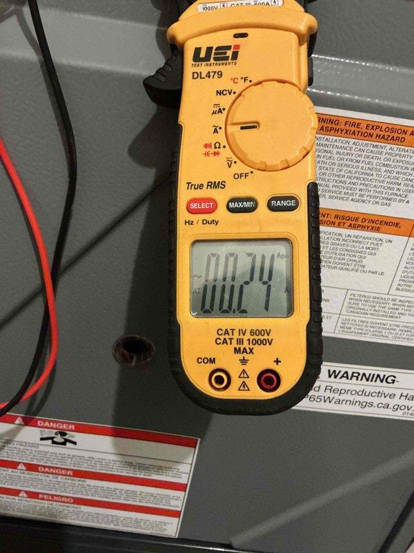 Performed comprehensive furnace inspection and tune-up on 7-year-old system. Diagnostic testing revealed expired UV bulb, though still functioning. All critical components (igniter, flame sensor, draft motor, blower motor) were operating properly with clean blower wheel. Combustion analysis confirmed safe and efficient operation despite minor heat exchanger rusting. Temperature and electrical readings were taken with digital thermometer and clamp meter to verify system parameters.