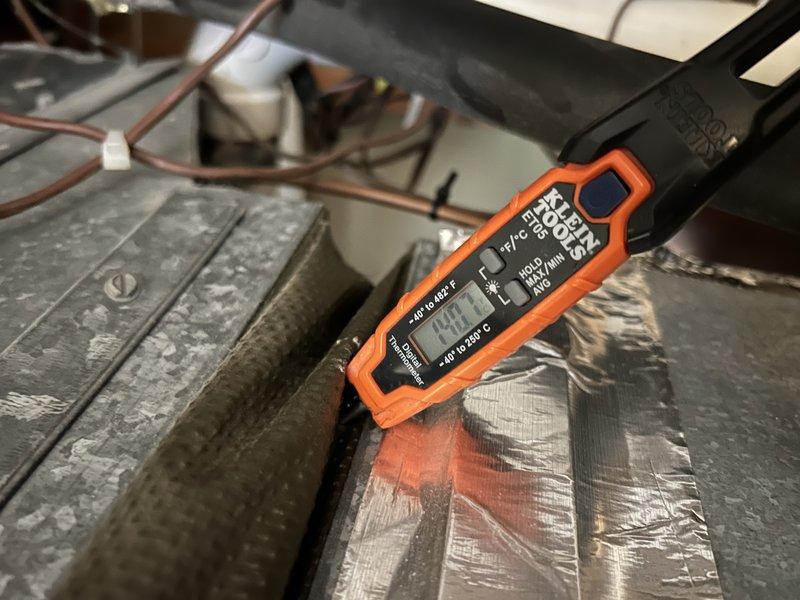 Serviced 18-year-old natural gas furnace with intermittent error codes requiring customer resets. Diagnostic testing revealed furnace is overheating due to age and condition. System inspection confirmed zoned configuration with single-stage furnace that has been previously adjusted to lower settings. Temperature readings taken with Klein Tools digital probe showed 44.1 degrees at test point.