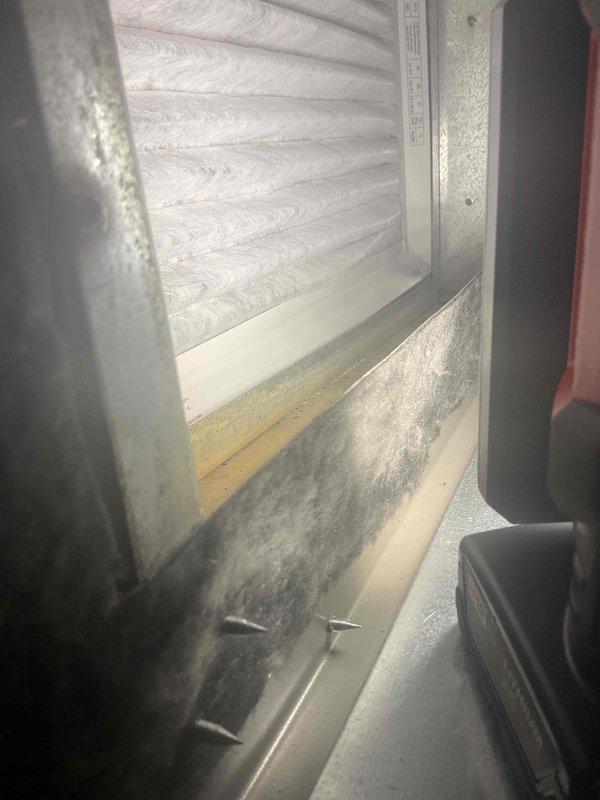 Inspected customer's recently installed furnace and identified improperly aligned filter rack causing air filter to sit at an angle, preventing proper installation of the access cover. Attempted adjustment of existing components but determined that the elbow and filter rack require replacement. Documented the issue with photos and advised customer that a follow-up service appointment will be scheduled to properly resolve the installation defect.