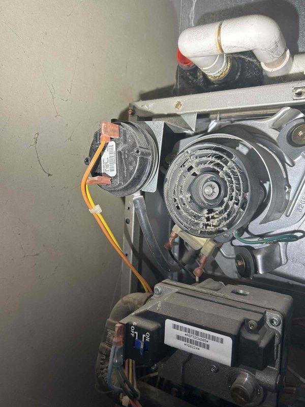 Performed comprehensive tune-up on 19-year-old furnace system. Identified and addressed weak flame sensor (reading 1.0-1.2 microamp), which was cleaned and replaced. Service included cleaning burners and orifice, replacing air filters, removing dust and debris buildup, and verifying thermostat connections when intermittent R-wire communication issues were detected. Confirmed safe carbon monoxide levels and proper gas pressure operation.