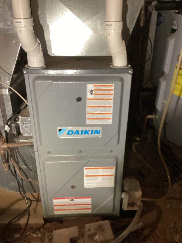 Responded to no-heat call on a Daikin propane furnace that failed to ignite after LP tank replacement. Diagnostic testing revealed clogged burners affecting proper combustion. Performed complete furnace service including cleaning of plugged burners and recommended replacement of existing burners with stainless steel alternatives to prevent future ignition failures.