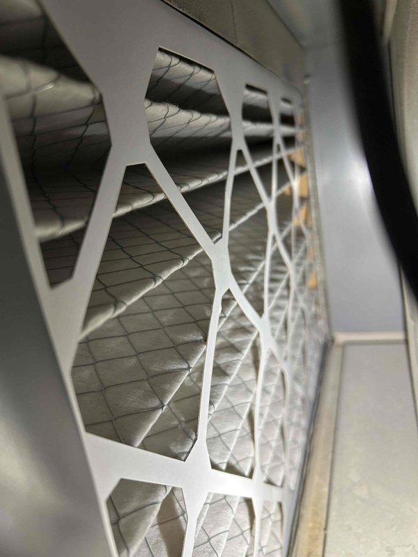 Performed comprehensive furnace tune-up and safety inspection, including gas leak detection, pressure switch operation verification, and carbon monoxide testing. Found and documented corrosion at unit base indicating previous moisture exposure. Conducted electrical component testing (flame igniter, gas valve solenoid, flame sensor), verified gas pressures for both heating stages, and cleared condensate trap. System restored to proper operation after all adjustments and connection verifications were completed.