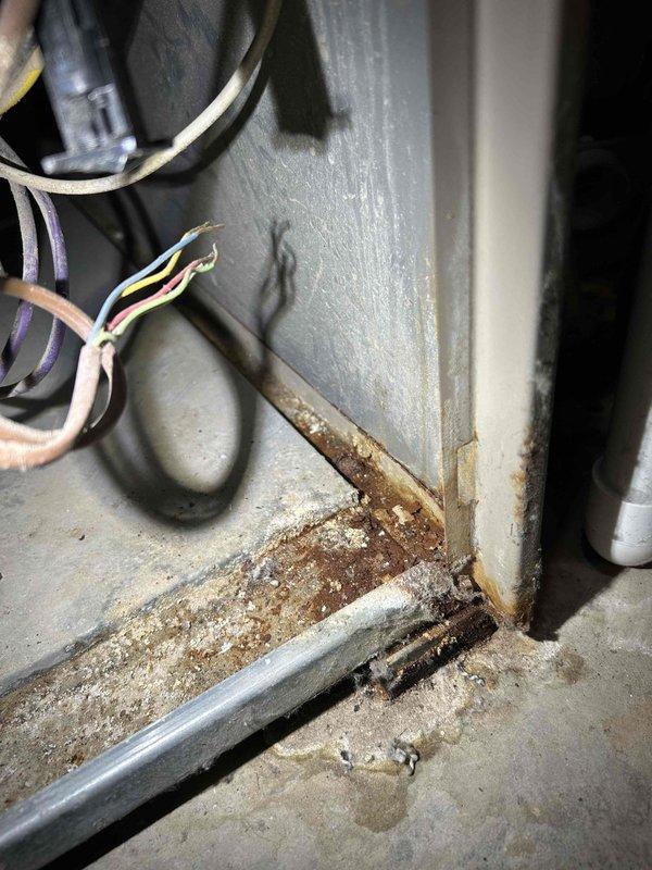 Performed comprehensive furnace tune-up and safety inspection, including gas leak detection, pressure switch operation verification, and carbon monoxide testing. Found and documented corrosion at unit base indicating previous moisture exposure. Conducted electrical component testing (flame igniter, gas valve solenoid, flame sensor), verified gas pressures for both heating stages, and cleared condensate trap. System restored to proper operation after all adjustments and connection verifications were completed.