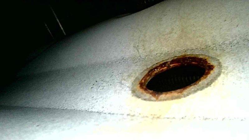 Inspected 17-year-old furnace system exhibiting intermittent shutdown issues. Diagnosed failed inducer motor assembly with significant mount deterioration allowing 1/8" lateral movement during operation. Observed extensive heat exchanger corrosion and replaced complete assembly due to safety concerns and advanced system age.