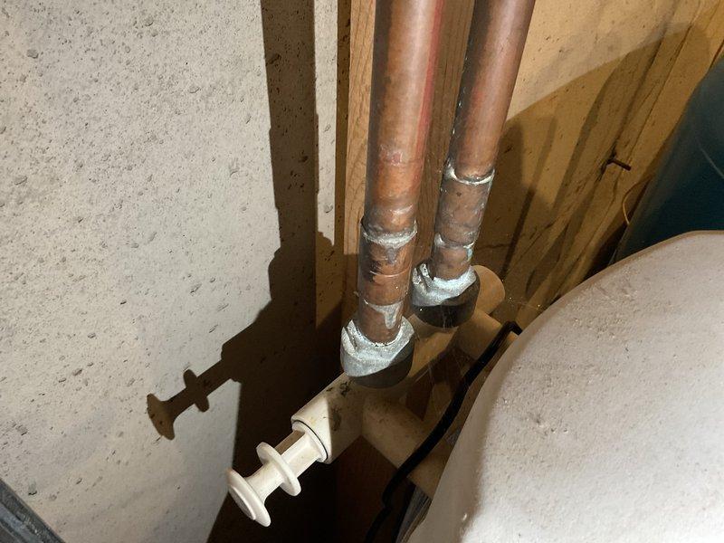 Responded to service call for LP water heater intermittently failing to ignite despite pilot light being on. Performed thorough cleaning of blower assembly, baffles, burner area, and bottom pan to remove accumulated debris affecting operation. Inspected aged unit, documenting evidence of wear. System was successfully restarted and functionality confirmed, though customer was advised that continued monitoring is recommended due to age of equipment.