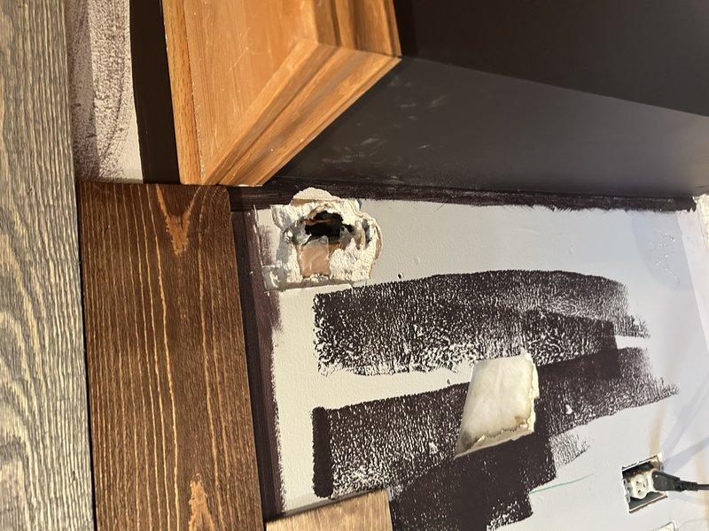 Responded to a service call for a 10-year-old R22 air conditioning system. Diagnosed a refrigerant line set puncture caused by customer's renovation activities (nail penetration). Photographic documentation obtained showing the damage to the wall and line set. Presented repair options and coordinated with service advisor for follow-up system replacement consultation.