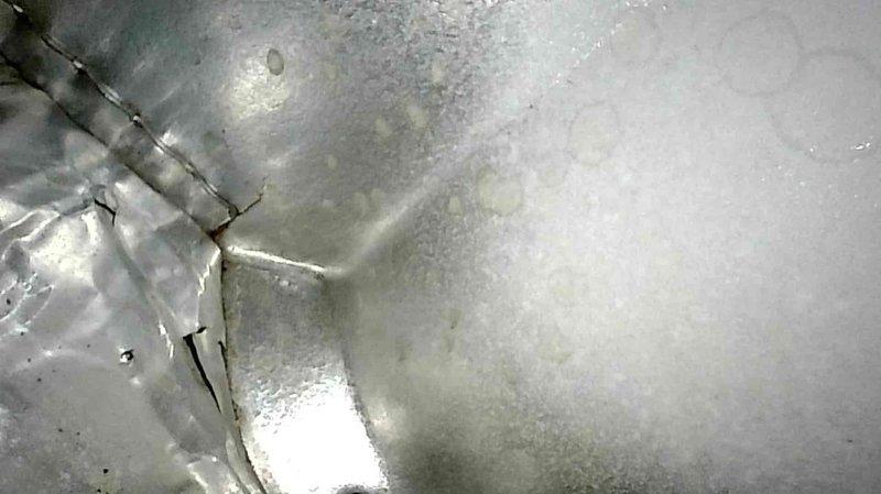 Responded to service call for non-functioning furnace. Upon arrival, system was operational after customer reset. Performed diagnostic check and furnace tune-up, identifying and cleaning heavily corroded flame sensor which likely caused previous non-start condition. Inspection revealed small crack in heat exchanger near crimp. Advised homeowner replacement is recommended due to crack and unit's 25-year age, though furnace is currently functioning properly.