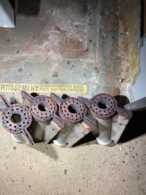 Performed furnace tune-up inspection and identified severely corroded burners requiring replacement. Completed parts order form for new burners. Examined ductwork in basement per customer's concern about insufficient heat output. System appears otherwise functional and in acceptable condition. Customer was advised about pellet stove motor issue but informed this falls outside our service scope.