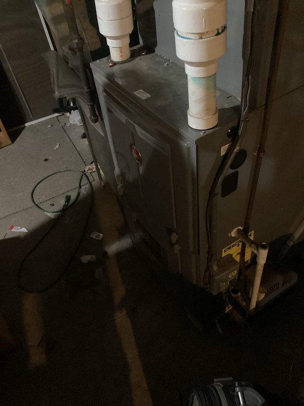 Performed routine maintenance on 10-year-old Rheem furnace as part of scheduled bi-annual service agreement. System is functioning properly with proper gas pressure, good electrical connections, and normal amp draws on motors. Cleaned flame sensor, verified ignitor operation, and confirmed condensate drains are clear. Noted concerning dark spots (possible mold) on exterior ductwork and questionable vent condition requiring future attention.