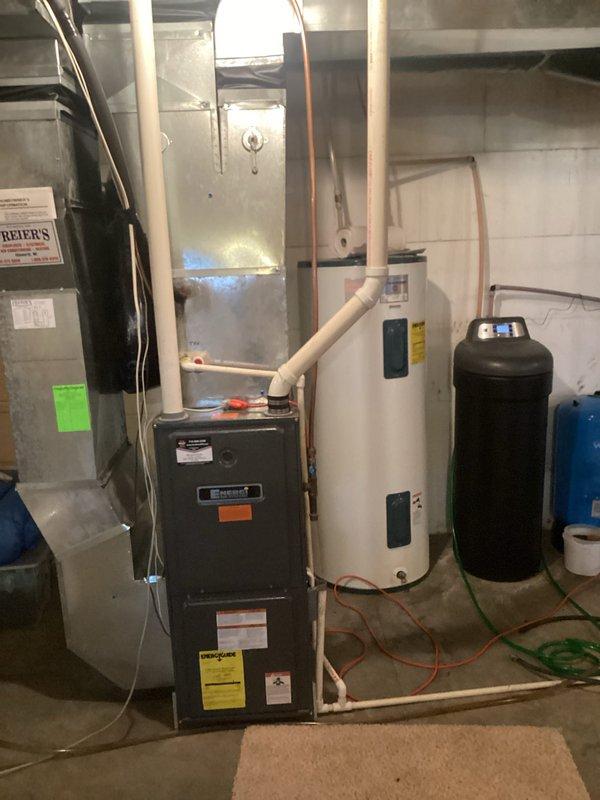 Performed comprehensive furnace tune-up service on residential system. Inspection revealed clean filter and proper gas pressures with temperature rise of 45 degrees. Noted blower wheel accumulating dirt with mechanical play; all electrical components including capacitor tested within specifications. Heat exchanger inspection showed no compromises. System tested and monitored for 20 minutes with normal operation. Customer informed about blower motor condition and future repair recommendations.