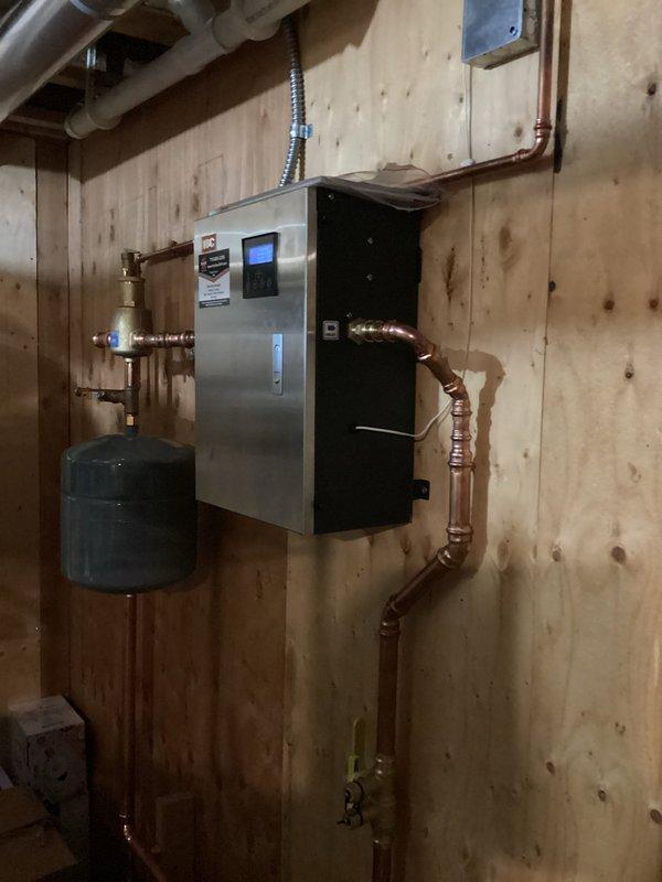 Performed scheduled HVAC agreement maintenance on two furnace units and electric boiler system. Comprehensive tune-up completed on both furnaces with all components functioning properly. Electric boiler was operational with satisfactory heating output. Visual inspection of mechanical room equipment including Lennox furnace unit, ductwork, and water heating system with expansion tank confirmed proper installation. No issues identified or repairs required.