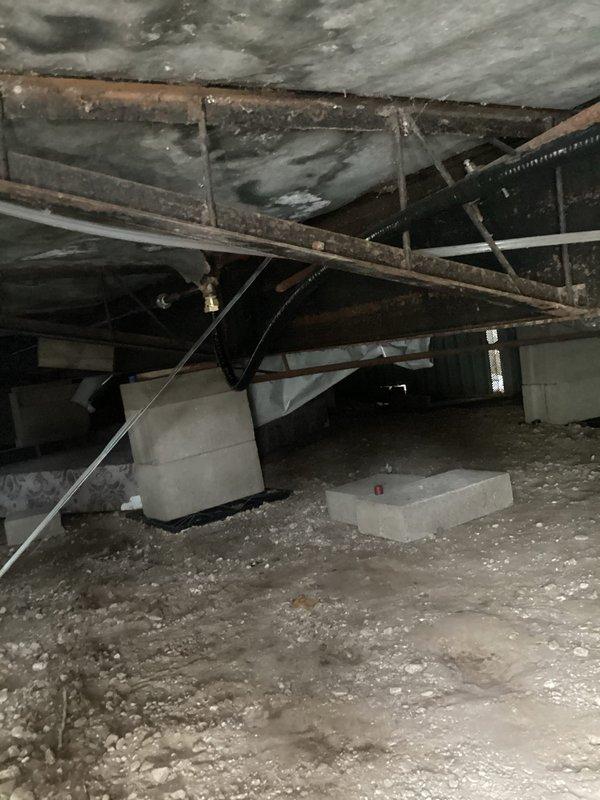 Replaced deteriorated gas piping under mobile home by removing leaking pipe and installing new 3/4" gas-tite line with appropriate fittings. Performed leak check on all new connections and purged air from gas lines servicing the stove and furnace. Customer declined purging of water heater gas line and indicated they would replace skirting independently.