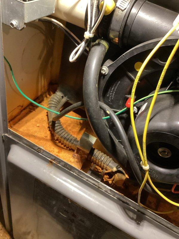 Performed semi-annual agreement maintenance service on furnace of indeterminate age. Completed comprehensive inspection including heat exchanger (camera inspection), venting, exhaust flue, burners, blower, inducer, all safety switches, flame sensor, igniter, and gas pressures. Noted rust damage inside furnace cabinet caused by condensate drainage issues from evaporator coil. System currently operating normally.