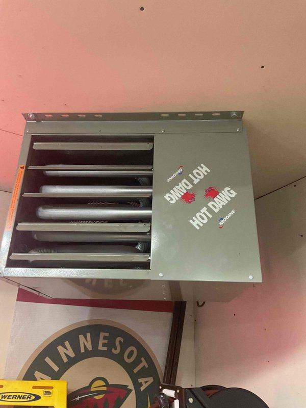Responded to no-heat call for garage-mounted Hot Dawg heater that failed to ignite. Diagnostic inspection revealed complete absence of gas supply to the unit. Recommended customer contact gas company for service as gas line is underground with no visible shutoff valve.