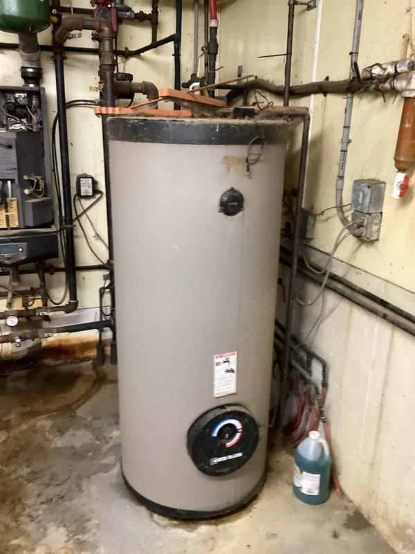 Responded to no-heat call for a barn boiler system. Diagnosed low water level in the aging boiler and replenished system water to restore operation. Unit is showing significant deterioration with corrosion on copper piping connections. Recommended replacement options to owner, including commercial water heater and unit heater installations, with estimates to follow.