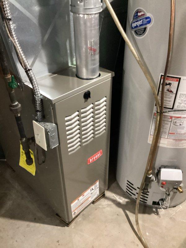 Performed furnace tune-up on 10-year-old Carrier unit with expected 15-20 year lifespan under routine maintenance. Inspection confirmed system is operating safely with proper gas pressure, clean filter, good electrical components and connections. Service included cleaning flame sensor, verifying ignitor operation, checking motor amp draws, and ensuring condensate drains were clear.