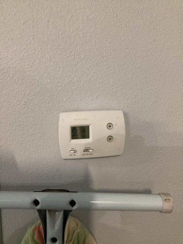 Responded to no-heat complaint for 10-year-old Reznor garage unit heater. Diagnostic testing revealed low battery warning on Honeywell thermostat. Replaced two AA batteries in thermostat which resolved the issue completely, restoring normal operation to the heating system.