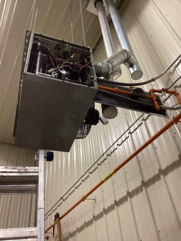 Diagnosed and serviced two non-functioning natural gas heaters in shop. One unit had a blown low voltage fuse on control board which was replaced and verified through complete heat cycle testing with no recurring issues. Second unit diagnosed with failed fan motor; replacement ordered per approved estimate.