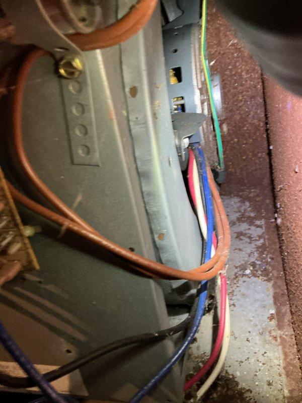 Performed routine maintenance tune-up on a 33-year-old Goodman furnace. Inspection revealed blower motor leaking oil and heat exchanger showing signs of wear. Recommended comfort advisor consultation for evaluation of aging system components.