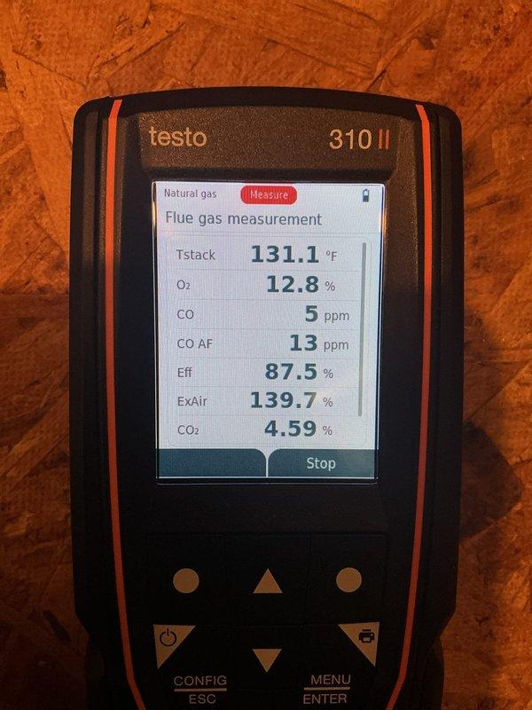 Performed furnace inspection and tune-up service. Combustion analysis showed system operating at 87.5% efficiency with acceptable CO levels (5 ppm). Identified multiple critical issues including failing ignition components, oil leakage from blower motor, burn marks on control board, and contaminated secondary heat exchanger. Recommended either component replacement or complete furnace replacement due to the extent of deterioration.