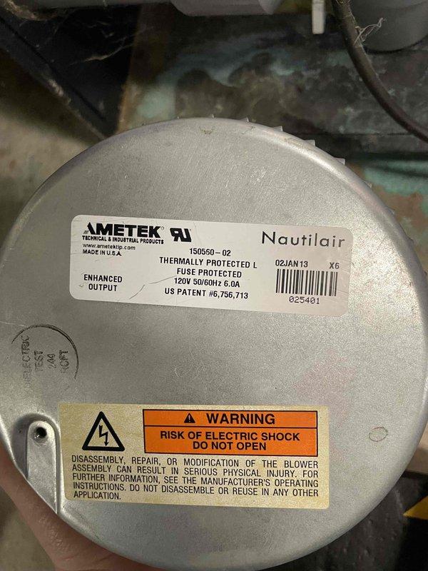 Responded to no heat/no hot water complaint on 13-year-old Phoenix HTP system. Diagnosed loud grinding noise from inducer motor. Upon inspection of the ECM variable speed inducer, discovered 120V winding was open with OL reading between hot and neutral. Inducer failed completely after inspection, resulting in total system shutdown. Recommended replacement of failed inducer motor and discussed options for system upgrade to combi unit or boiler with indirect tank.