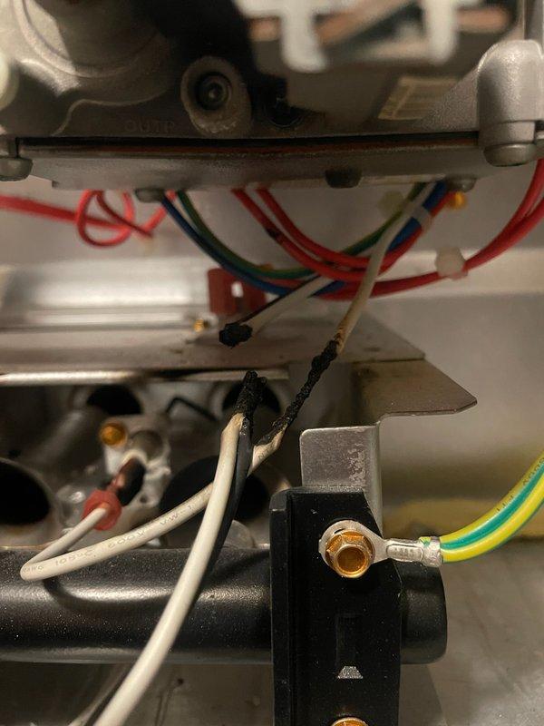 Responded to no heat call for a SmartComfort unit where igniter and flame sensor wires had fallen in front of burner and melted through. Repaired damaged wiring connections and verified proper system operation. Identified collector box leak at inducer seal and condensate drain; recommended replacement. Heat exchanger inspection showed no compromises.