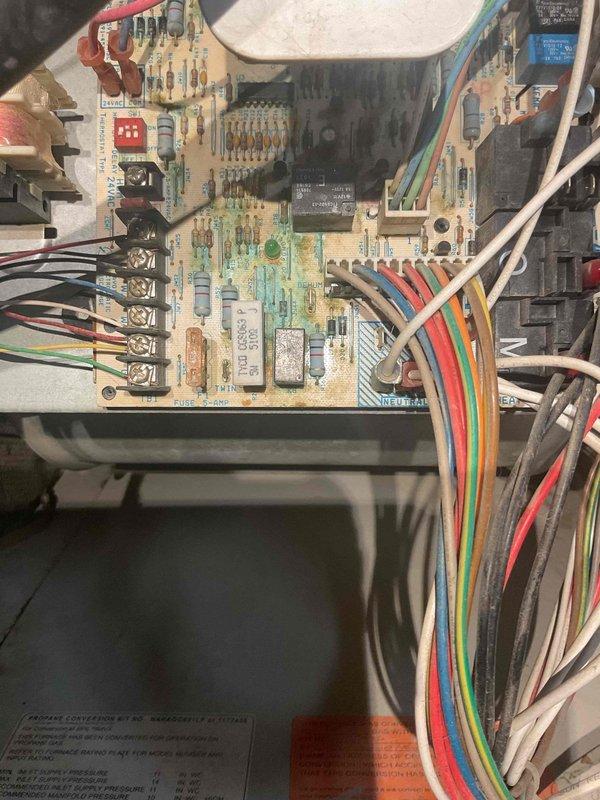 Diagnosed 7+ year old natural gas furnace exhibiting failure to ignite symptoms. Visual inspection revealed damaged control board with discoloration and corrosion. Due to the unit's age and potential for additional issues, recommended and performed complete system replacement rather than board repair. Set up emergency service contact information and provided documentation on control board replacement option.