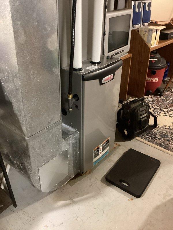 Performed annual furnace tune-up on 2-year-old Lennox natural gas furnace. Completed full system inspection with no major issues identified. Adjusted gas pressure at both low and high fire settings per manufacturer specifications. Replaced broken pressure switch port with spare part from inventory and documented for warranty claim.