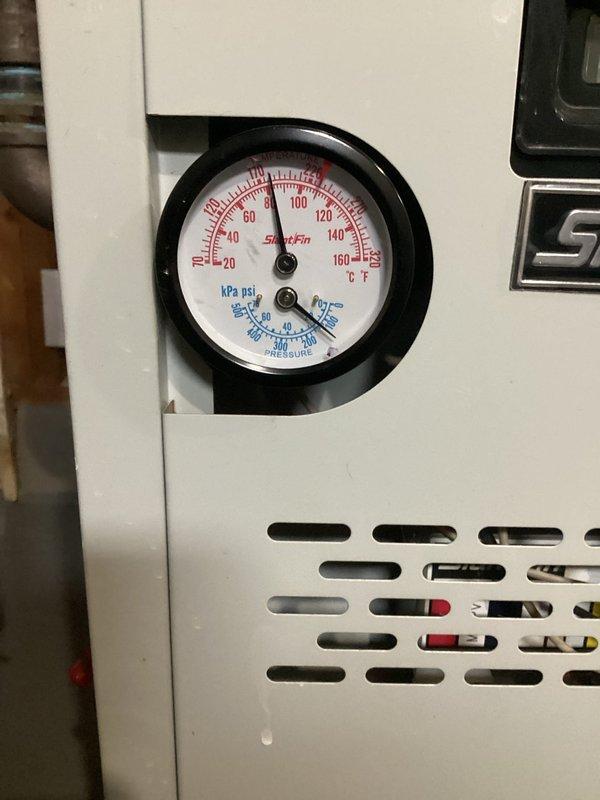 Responded to callback regarding air in boiler system causing noise through main level. Upon arrival, performed system bleeding to remove trapped air. Pressure gauge inspection showed appropriate system pressure following service. Previously installed zone valve for bedroom zone remains operational.