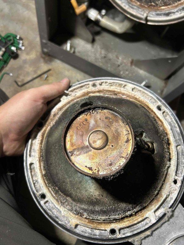 Performed scheduled boiler tune-up service, cleaning drain system and ignition assembly components. Inspection revealed severely deteriorated burner refractories with significant corrosion and sediment buildup in the combustion chamber. Customer will be provided with replacement options and pricing.