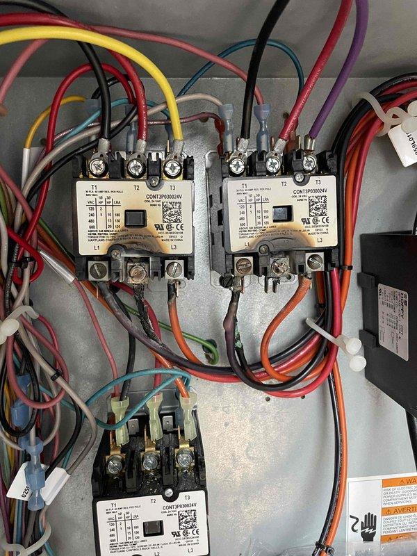 Performed semi-annual preventative maintenance on two RTUs including filter replacement (4-20x25x2 and 4-25x25x2), cleaning flame sensors and spark rods, and blowing out pressure switch hoses and ports. Identified failed contactors on the kitchen/south side unit causing continuous condenser fan motor operation; prepared and submitted estimate for replacement contactors to owner after discussing findings with on-site manager.